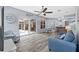 Open-concept living room with a view of the pool, comfortable seating, and stylish decor at 4505 Anaconda Dr, New Port Richey, FL 34655