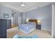 Well-lit main bedroom boasts neutral walls, a ceiling fan, and ample closet space for storage at 4505 Anaconda Dr, New Port Richey, FL 34655