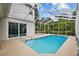 Beautiful screened-in pool with clear blue water and a spacious deck perfect for outdoor relaxation at 4505 Anaconda Dr, New Port Richey, FL 34655