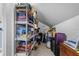 Attic storage space with organized shelving filled with board games and luggage at 4505 Anaconda Dr, New Port Richey, FL 34655