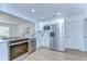 Updated kitchen with stainless steel appliances and white cabinetry at 4605 W Loughman St, Tampa, FL 33616