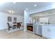 The kitchen and dining area showcases a modern design with stainless steel appliances at 4605 W Loughman St, Tampa, FL 33616