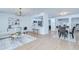 Bright and airy living space featuring hardwood floors, an open layout, and seamless flow to dining and kitchen at 4605 W Loughman St, Tampa, FL 33616