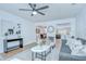 Bright living room with modern decor and an open floor plan to the dining area and kitchen at 4605 W Loughman St, Tampa, FL 33616
