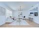 Spacious living room features an open layout, hardwood floors, modern lighting, and neutral color palette at 4605 W Loughman St, Tampa, FL 33616