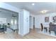 A bright, airy room showcasing the living space with wood-look flooring at 4605 W Loughman St, Tampa, FL 33616