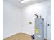 Utility room featuring laundry hookups, modern flooring, and door to outside at 4605 W Loughman St, Tampa, FL 33616