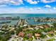 Stunning aerial view of waterfront homes with private docks and beautiful bay views on a sunny day at 5904 Pelican Bay S Plz, Gulfport, FL 33707