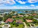 High-angle view captures serene waterfront homes and the expansive bay area, highlighting the community's charm at 5904 Pelican Bay S Plz, Gulfport, FL 33707