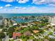 Panoramic aerial showcasing luxurious waterfront homes, scenic bay, and vibrant community on a clear day at 5904 Pelican Bay S Plz, Gulfport, FL 33707