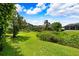 A picturesque backyard with lake views and lush vegetation at 5904 Pelican Bay S Plz, Gulfport, FL 33707