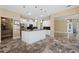 Spacious kitchen featuring a center island with granite countertops, stainless appliances and custom cabinets at 5904 Pelican Bay S Plz, Gulfport, FL 33707