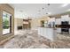 Open floor plan with a fireplace, recessed lighting, ceramic floors, and stainless appliances at 5904 Pelican Bay S Plz, Gulfport, FL 33707