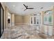 Open-concept living room with double doors, high ceilings, recessed lighting and beautiful tile flooring at 5904 Pelican Bay S Plz, Gulfport, FL 33707