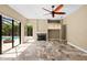Bright living room with a fireplace, tile flooring, a ceiling fan, recessed lighting, and view of the pool at 5904 Pelican Bay S Plz, Gulfport, FL 33707