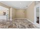 Bright living room with ceramic floors, neutral paint and a large entrance leading to another room at 5904 Pelican Bay S Plz, Gulfport, FL 33707