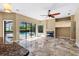 Spacious Gathering room with tile flooring, access to the pool, fireplace, and neutral paint at 5904 Pelican Bay S Plz, Gulfport, FL 33707