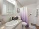 Cozy bathroom with a shower/tub, white tile and an updated vanity at 5920 80Th N St # 406, St Petersburg, FL 33709