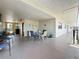 Relaxing common area with chairs, tables, plants, and outdoor view at 5920 80Th N St # 406, St Petersburg, FL 33709