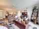 Comfortable living room with hardwood floors, ceiling fan and ample natural light at 5920 80Th N St # 406, St Petersburg, FL 33709
