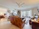 Cozy living room featuring hardwood floors, access to the bedroom and a sliding door to the balcony at 5920 80Th N St # 406, St Petersburg, FL 33709