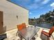 A cozy outdoor patio with comfortable seating and views of the beautiful lake at 5920 80Th N St # 406, St Petersburg, FL 33709