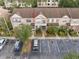 Aerial view of townhome with colorful shutters and well-manicured landscaping at 6336 Bayside Key Dr, Tampa, FL 33615