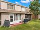 The backyard features a patio with an air conditioning unit at 6336 Bayside Key Dr, Tampa, FL 33615