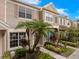 Exterior elevation of a townhome showcasing tidy landscaping and a private entrance at 6336 Bayside Key Dr, Tampa, FL 33615