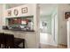 Open kitchen featuring wooden cabinets and granite countertops adjacent to a stairway at 6336 Bayside Key Dr, Tampa, FL 33615