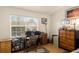 Office space with natural lighting, desk, wood floors and ample storage at 6336 Bayside Key Dr, Tampa, FL 33615
