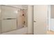 Shower and tub combination including sliding glass door and tiled showerhead at 6336 Bayside Key Dr, Tampa, FL 33615