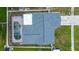 Aerial view of the property highlighting the pool, roof, driveway and fenced backyard at 6460 101St N Ave, Pinellas Park, FL 33782