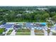 Aerial view of the home showcasing a landscaped yard, pool, and suburban surroundings at 6460 101St N Ave, Pinellas Park, FL 33782