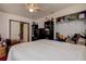 Bedroom with a ceiling fan, white walls, large window, and walk-in closet at 6460 101St N Ave, Pinellas Park, FL 33782