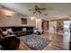 Expansive living area with wood floors, a dining space, and a comfortable sectional sofa at 6460 101St N Ave, Pinellas Park, FL 33782