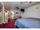 Spacious main bedroom with red carpet and an ensuite bathroom at 6460 101St N Ave, Pinellas Park, FL 33782