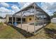 Full view of the screened pool enclosure connecting the house with the backyard at 6460 101St N Ave, Pinellas Park, FL 33782