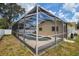 Corner view of screened pool enclosure, connecting the house to the backyard at 6460 101St N Ave, Pinellas Park, FL 33782
