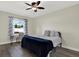 Cozy bedroom with laminate flooring, ceiling fan, and a window with natural light at 679 Challice Dr, Spring Hill, FL 34609