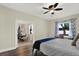 Bedroom featuring laminate flooring with dining area view at 679 Challice Dr, Spring Hill, FL 34609