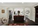 Welcoming foyer with hardwood floors and elegant furnishings offers a grand entrance to the home's interior at 679 Challice Dr, Spring Hill, FL 34609