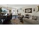 Spacious living room showcases an open floor plan, elegant furnishings, and seamless access to dining area at 679 Challice Dr, Spring Hill, FL 34609
