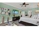 Bright main bedroom featuring a decorative wood dresser, soothing wall color, and beach-themed decor accents at 679 Challice Dr, Spring Hill, FL 34609