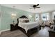 Spacious main bedroom suite with chandeliers and sitting area at 679 Challice Dr, Spring Hill, FL 34609