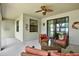 Inviting covered patio with cozy seating area, perfect for relaxing and enjoying the backyard view at 679 Challice Dr, Spring Hill, FL 34609