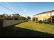 Spacious backyard with lush lawn, privacy fence and a covered patio for outdoor relaxation at 6940 47Th N Way, Pinellas Park, FL 33781