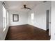 Bright main bedroom with wood floors, a ceiling fan, and ample natural light from large windows at 6940 47Th N Way, Pinellas Park, FL 33781