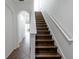 Staircase with wood treads and white risers leading to the upper level of the home at 6940 47Th N Way, Pinellas Park, FL 33781