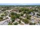 Expansive aerial view of a residential neighborhood with lush greenery and tree-lined streets at 8009 Somerset Ln, Tampa, FL 33615